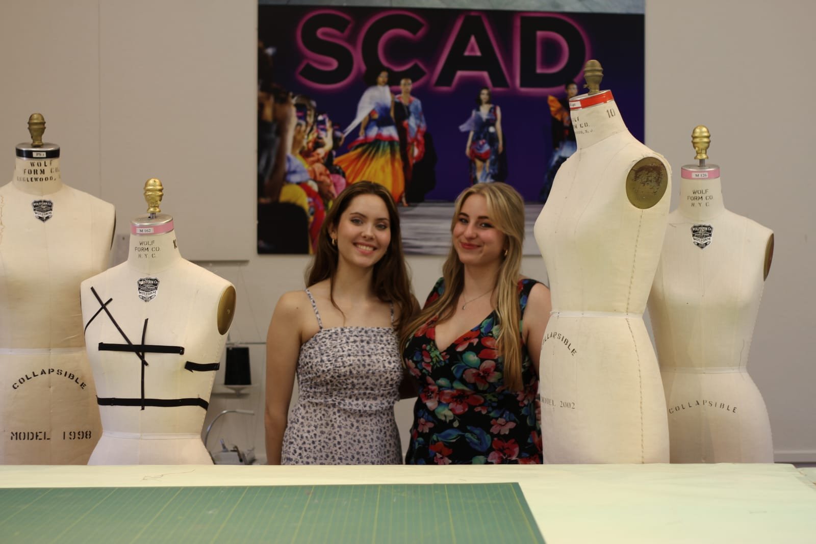 Jules and a friend among the dress forms in the SCAD fashion studio